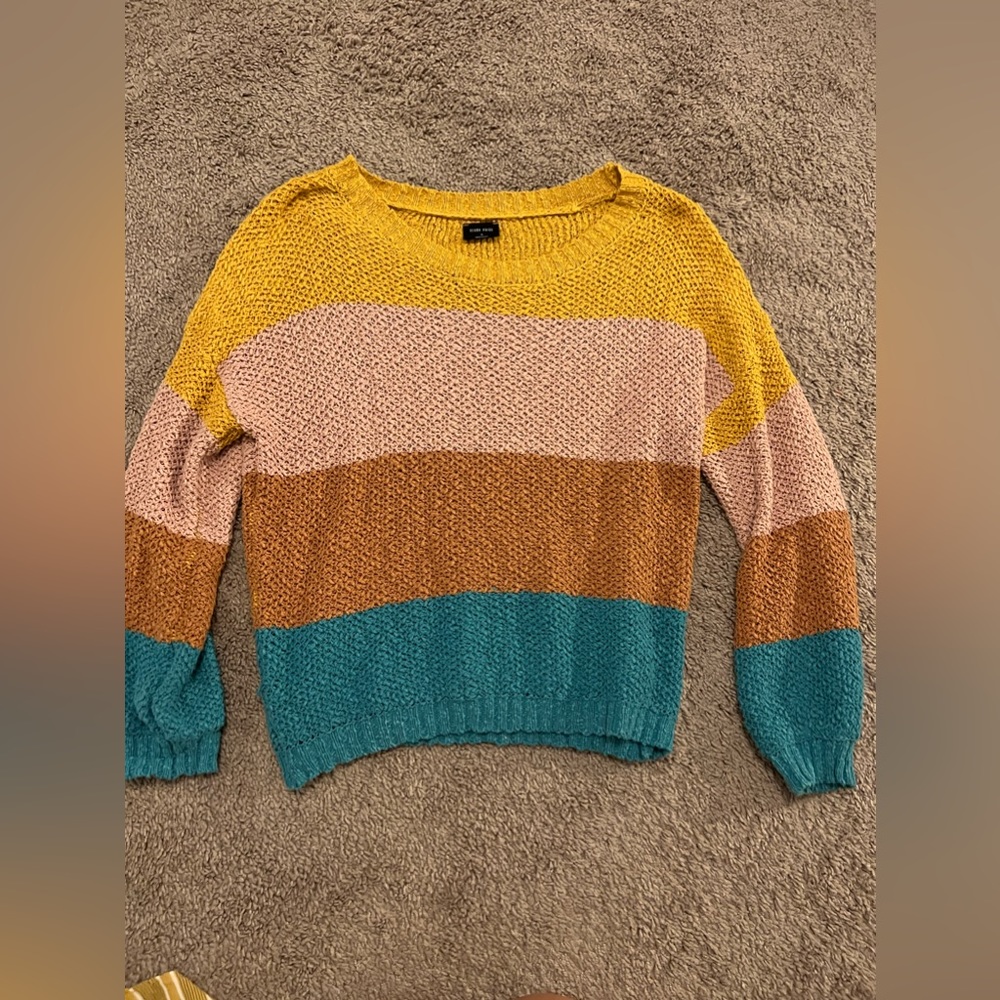 This is a sweater from a local boutique, it is a size medium!